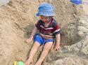 Tyler covered in sand